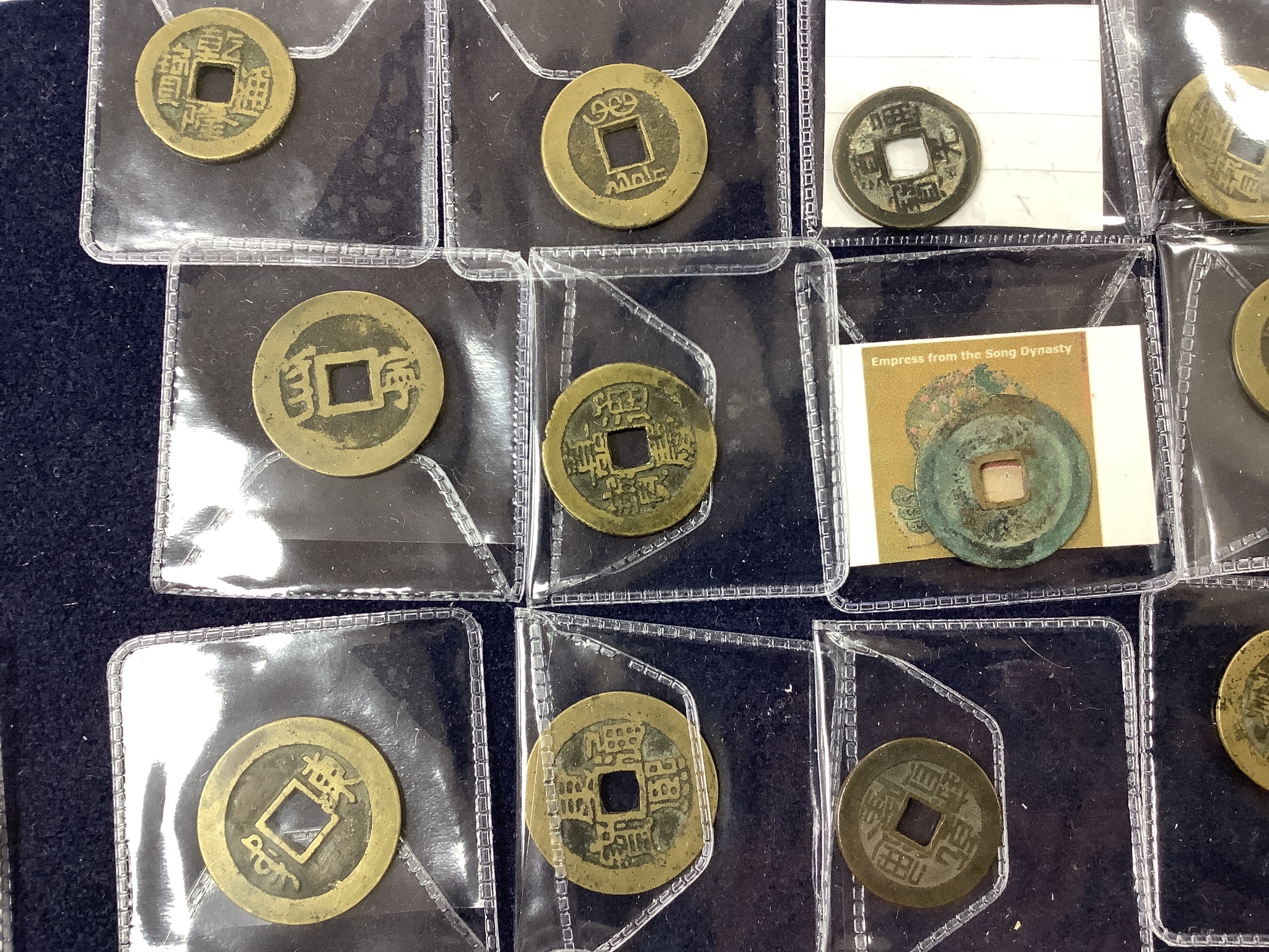A collection of Chinese coins, stamps and two Japanese banknotes